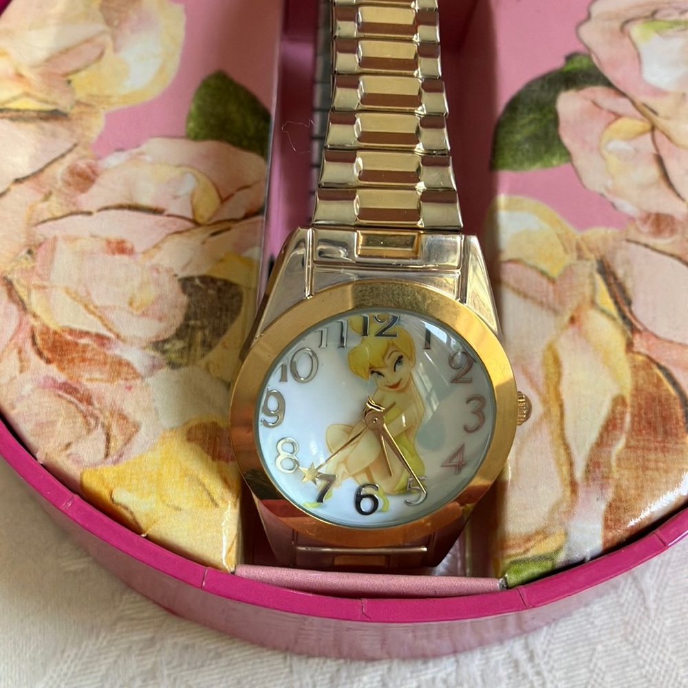 Disney Tinkerbell watch w/stretch metal band. Sealed i.e. brand new. Box incl.